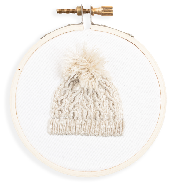 Finished embroidery ornament of cable knit hat in antique white
