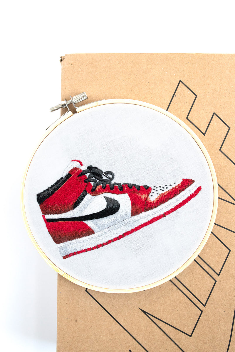 Finished needle painting of sneaker in red and black