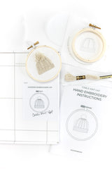 Components included in cable knit hat embroidered ornament kit