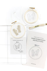 Kit for embroidering a tree ornament featuring knit gloves