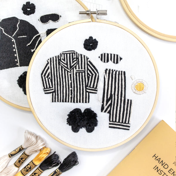 Finished embroidery hoop featuring black and white striped pajamas