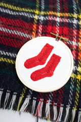 Finished embroidered tree ornament of red socks by kdornbier